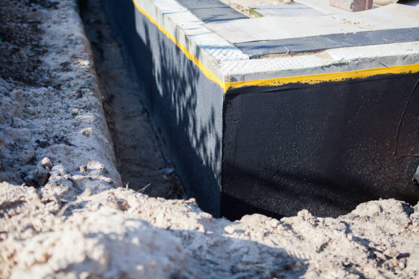 Professional Emergency Waterproofing technician working in Roanoke, IL